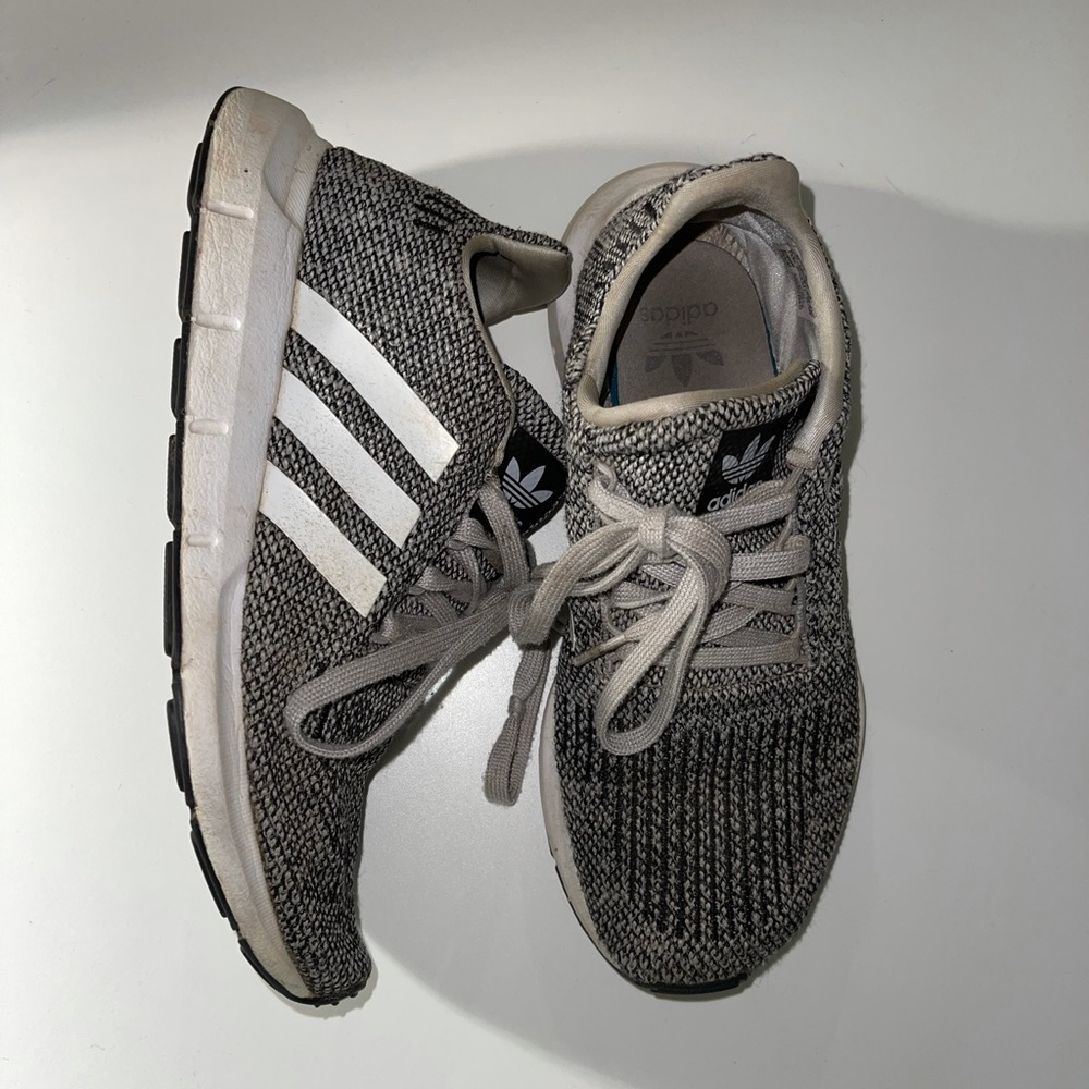 Grey and white adidas athletic shoes